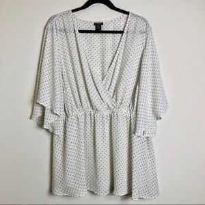 Torrid white polka dot printed blouse.